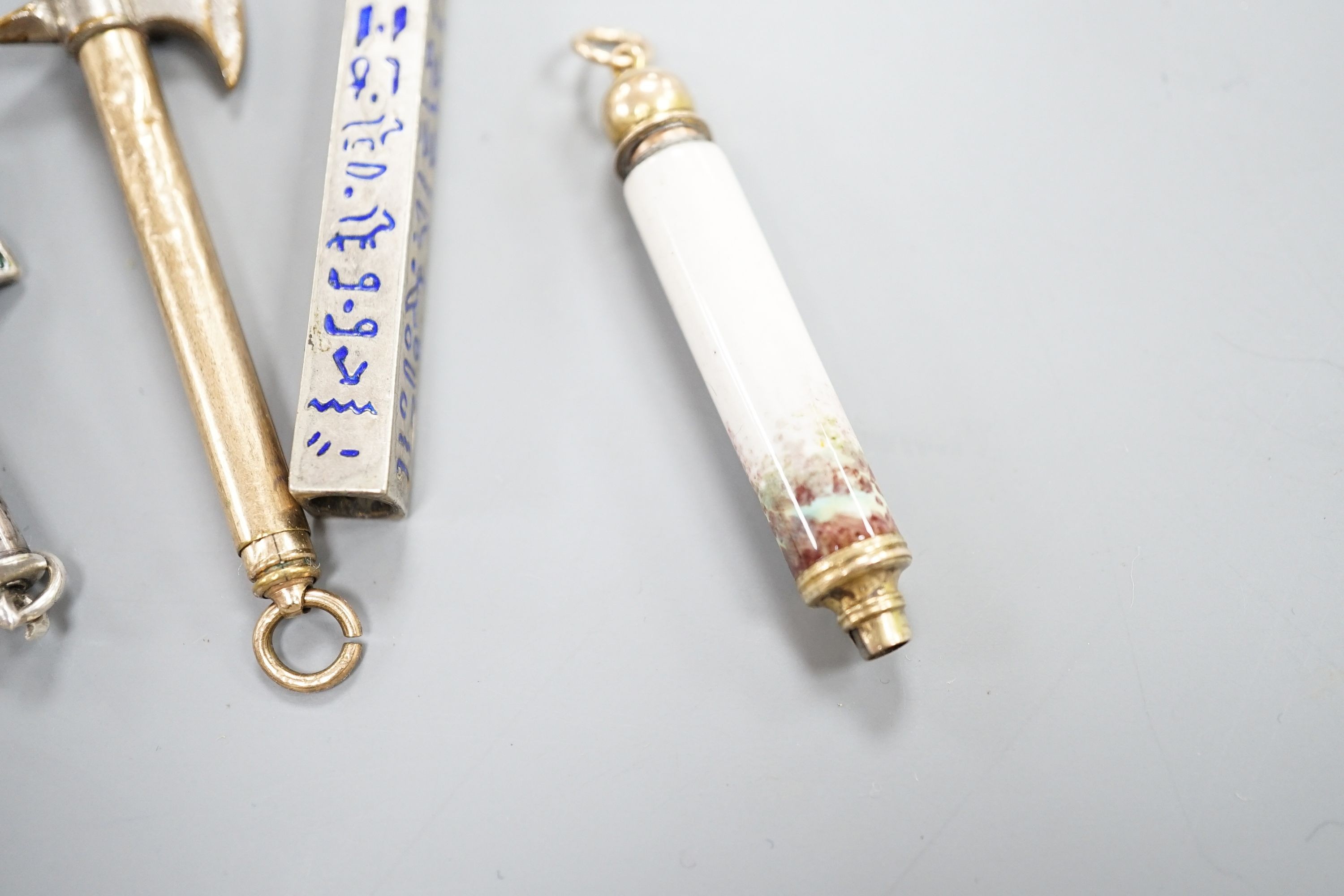 Four assorted pencils, including three enamelled and novelty modelled as an axe
